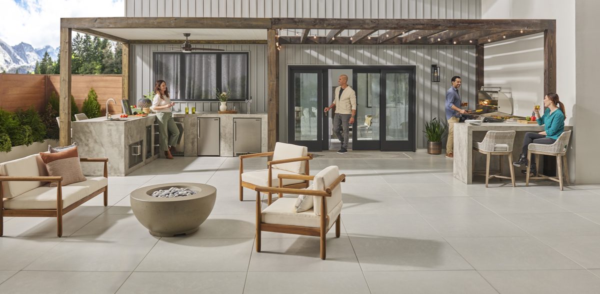 Fire Magic outdoor kitchen islands and a round gas fire bowl on a patio
