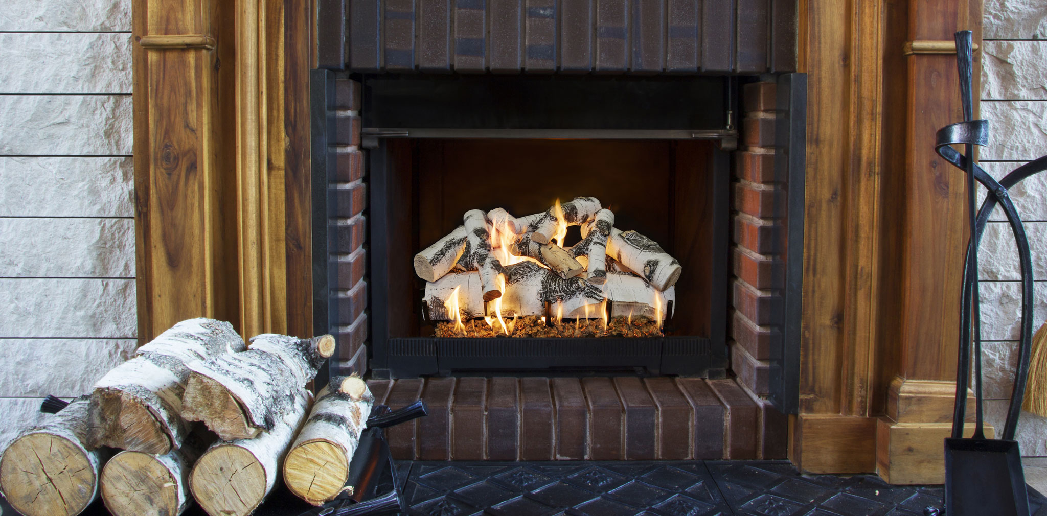 Grand Canyon Quaking Aspen birch gas logs burning in a brick fireplace