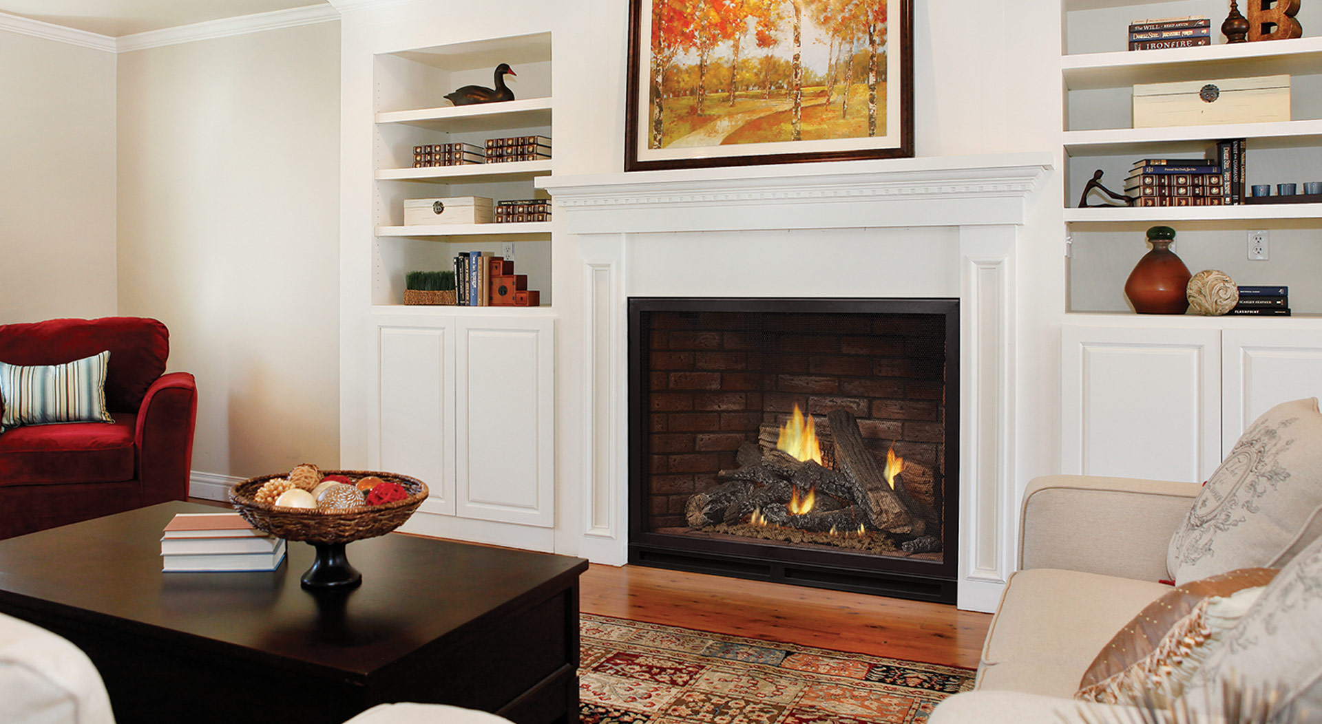 White Mountain Hearth gas log set burning in a brick fireplace with a white mantel