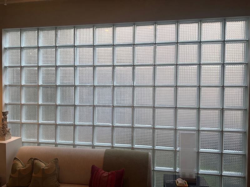 Finished interior glass-block wall with waffle-pattern units, clean mortar joints, and even light across the full panel after Madewell repair in Memphis