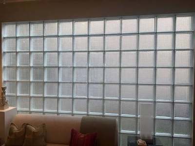 Finished interior glass-block wall with waffle-pattern units, clean mortar joints, and even light across the full panel after Madewell repair in Memphis