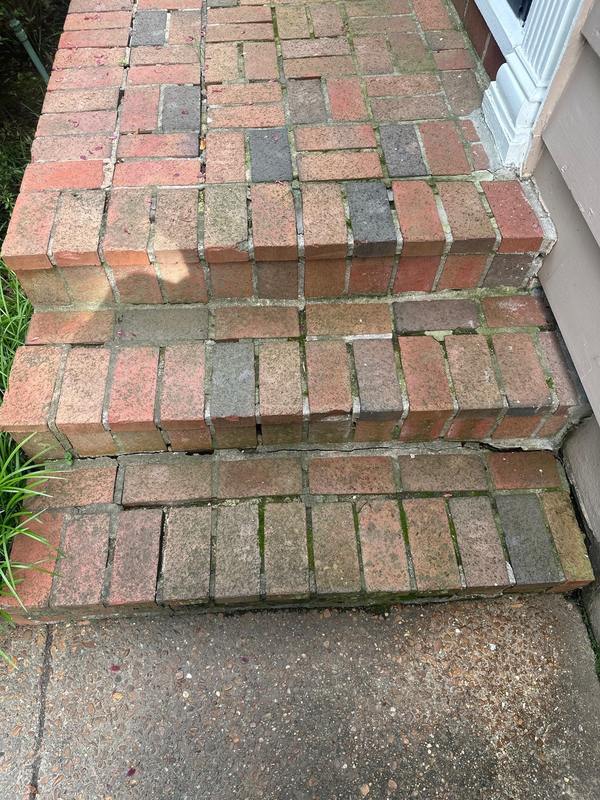 Cracked and separating brick front steps before masonry repair