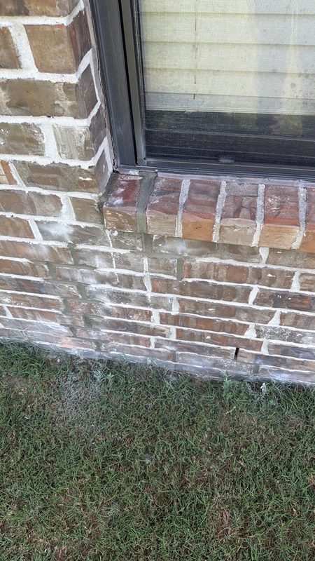 Rebuilt brick window sill and jamb corner with new mortar joints after Madewell masonry leak repair in Memphis