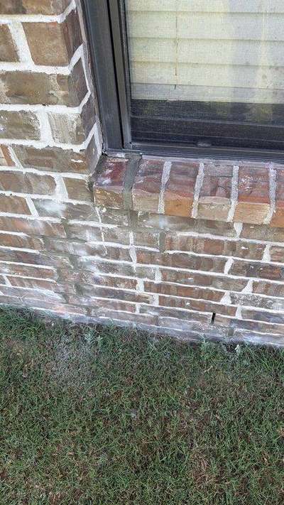 Rebuilt brick window sill and jamb corner with new mortar joints after Madewell masonry leak repair in Memphis
