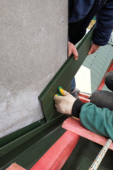 Chimney flashing being put in place - Madewell Masonry