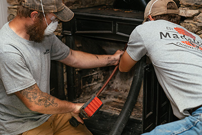 Technicians working on fireplace - Madewell Masonry3