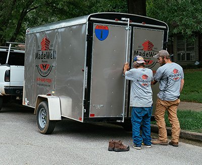 Techs standing at Madewell Masonry trailer