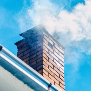 smoke coming out of a masonry masonry chimney