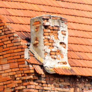 a masonry chimney that's broken down and patched up poorly